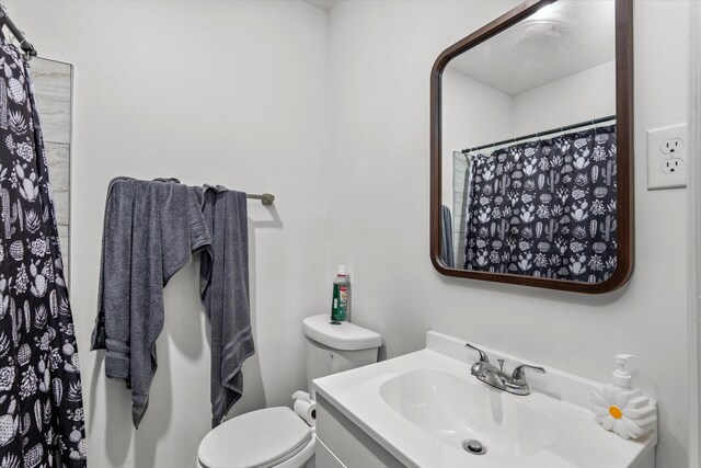 2156 Telfair St, Augusta, GA 30904 - bathroom with toilet, vanity, and a shower with shower curtain