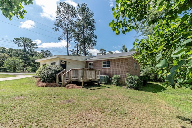 2383 Wheeless Rd, Augusta, GA 30906 - rear view of house featuring a yard, a deck, and brick siding