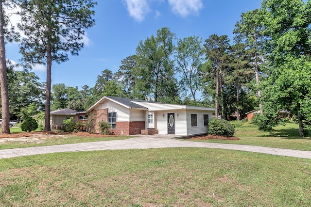 2383 Wheeless Rd, Augusta, GA 30906 - ranch-style home with concrete driveway, a front yard, and brick siding