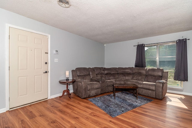 2383 Wheeless Rd, Augusta, GA 30906 - living room featuring wood finished floors and a textured ceiling
