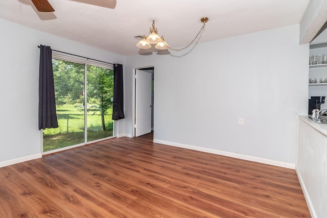 2383 Wheeless Rd, Augusta, GA 30906 - unfurnished room with a chandelier, wood finished floors, and ceiling fan