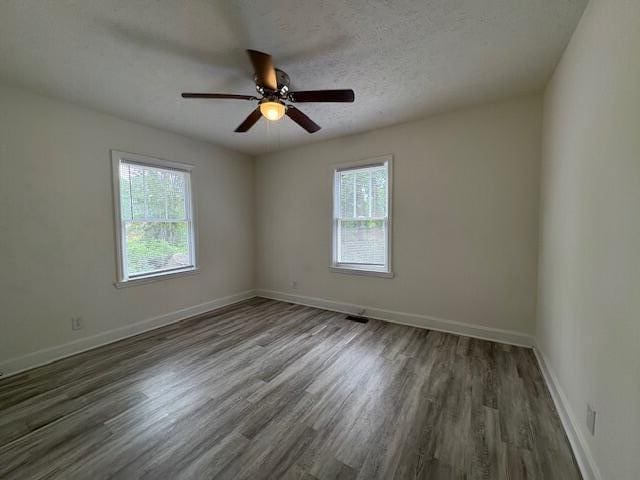 2315 Ridge Rd, Augusta, GA 30906 - empty room featuring plenty of natural light, wood finished floors, a ceiling fan, and a textured ceiling
