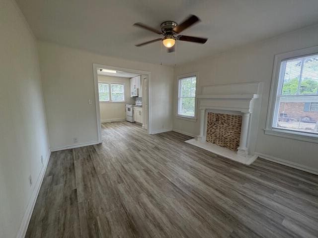2315 Ridge Rd, Augusta, GA 30906 - unfurnished living room with wood finished floors, ceiling fan, and a fireplace