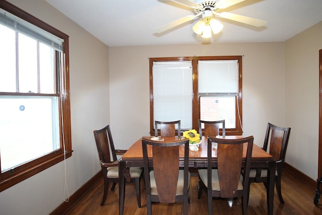 dining space featuring ceiling fan and dark hardwood / wood-style floors