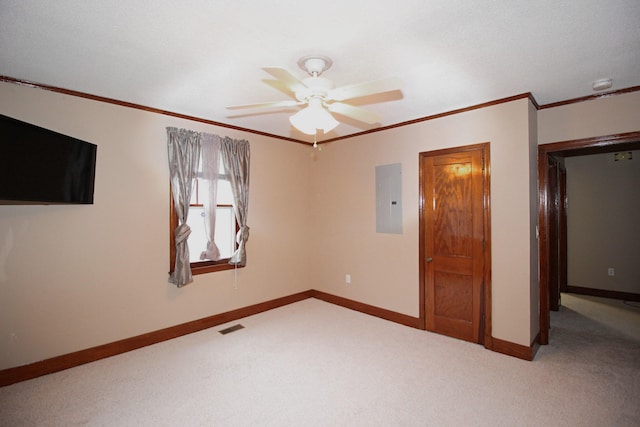 unfurnished bedroom featuring carpet flooring, electric panel, ceiling fan, and ornamental molding