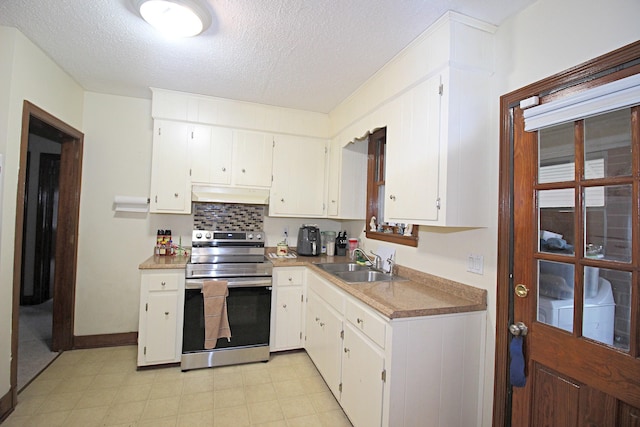 kitchen with stainless steel electric stove, white cabinets, sink, and a textured ceiling