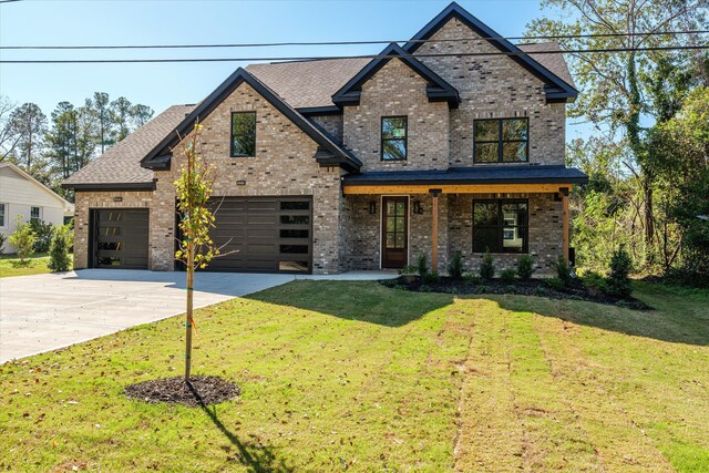 view of front of home featuring a front yard and a porch