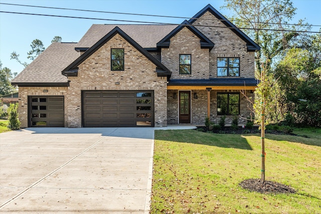 view of front of house featuring a porch, a garage, and a front lawn