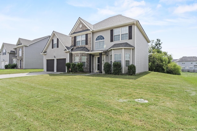 view of front of house with a front yard and a garage