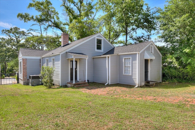1743 King Woods Dr, Augusta, GA 30904 - view of front of property featuring a chimney, central air condition unit, and roof with shingles