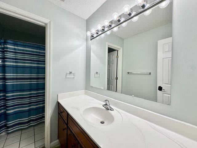 3129 Goolsby Rd, Blythe, GA 30805 - full bath featuring vanity, tile patterned flooring, a textured ceiling, and a shower with shower curtain