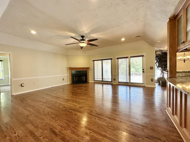 3129 Goolsby Rd, Blythe, GA 30805 - unfurnished living room featuring a textured ceiling, a ceiling fan, dark wood-style flooring, healthy amount of natural light, and recessed lighting