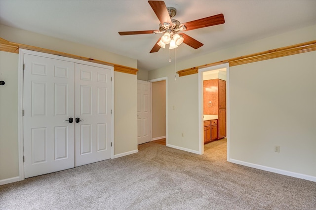3129 Goolsby Rd, Blythe, GA 30805 - unfurnished bedroom featuring light colored carpet, a closet, ceiling fan, and connected bathroom