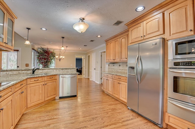 3129 Goolsby Rd, Blythe, GA 30805 - kitchen featuring stainless steel appliances, a warming drawer, light wood finished floors, decorative backsplash, and light brown cabinets