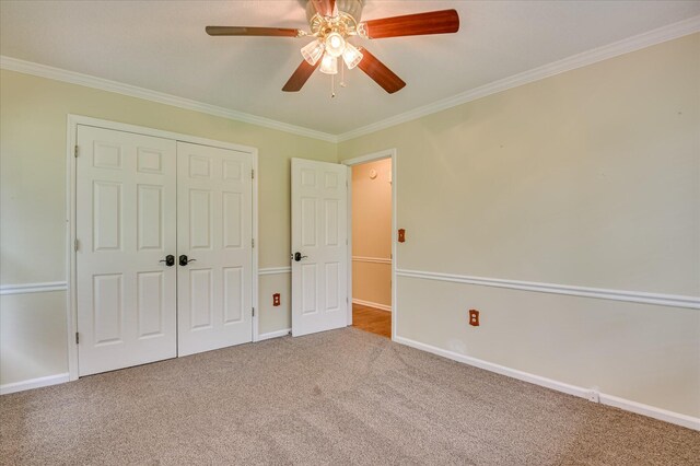 3129 Goolsby Rd, Blythe, GA 30805 - unfurnished bedroom with carpet flooring, crown molding, a closet, and ceiling fan