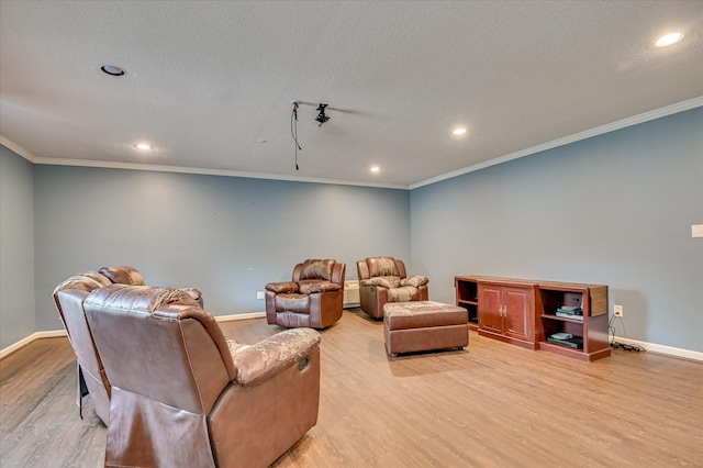 3129 Goolsby Rd, Blythe, GA 30805 - home theater room featuring light wood-style flooring, recessed lighting, crown molding, and a textured ceiling