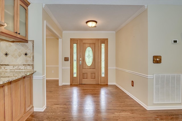 3129 Goolsby Rd, Blythe, GA 30805 - entrance foyer featuring light wood-type flooring and ornamental molding