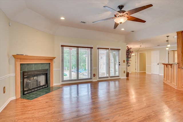 3129 Goolsby Rd, Blythe, GA 30805 - unfurnished living room featuring wood finished floors, a tiled fireplace, a ceiling fan, and recessed lighting