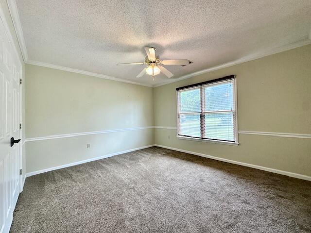 3129 Goolsby Rd, Blythe, GA 30805 - carpeted empty room with a textured ceiling, ceiling fan, ornamental molding, and baseboards