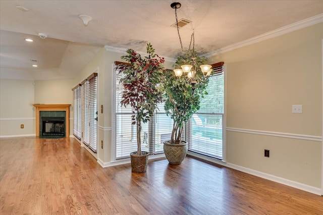 3129 Goolsby Rd, Blythe, GA 30805 - dining room with wood finished floors, a chandelier, a tiled fireplace, ornamental molding, and recessed lighting