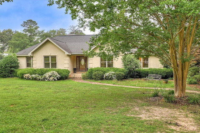 3129 Goolsby Rd, Blythe, GA 30805 - view of front facade featuring a front yard, stucco siding, and roof with shingles