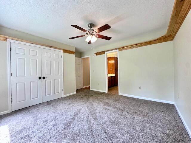 3129 Goolsby Rd, Blythe, GA 30805 - unfurnished bedroom with carpet, baseboards, and a textured ceiling
