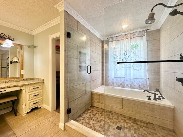 3129 Goolsby Rd, Blythe, GA 30805 - full bath with a textured ceiling, tile patterned floors, a stall shower, crown molding, and a garden tub