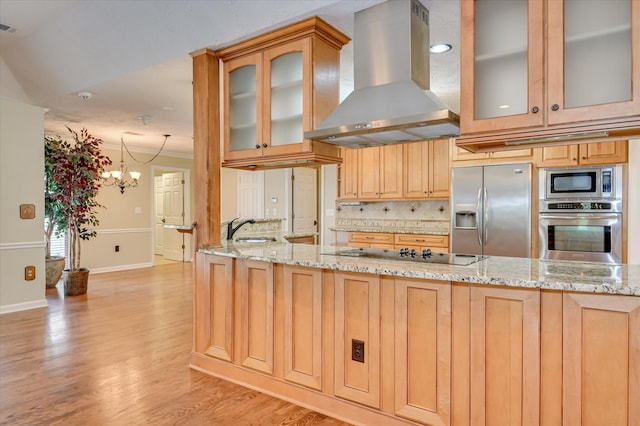 3129 Goolsby Rd, Blythe, GA 30805 - kitchen with wall chimney range hood, stainless steel appliances, tasteful backsplash, and light stone countertops
