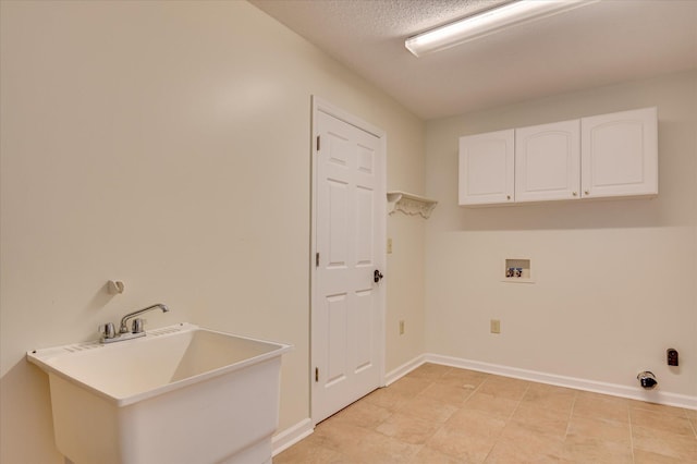 3129 Goolsby Rd, Blythe, GA 30805 - laundry room featuring cabinet space, hookup for a washing machine, and a textured ceiling