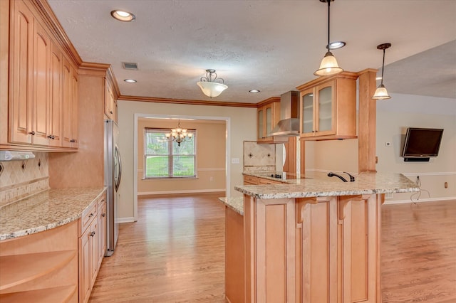 3129 Goolsby Rd, Blythe, GA 30805 - kitchen featuring wall chimney range hood, stainless steel fridge, glass insert cabinets, light wood-style floors, and recessed lighting