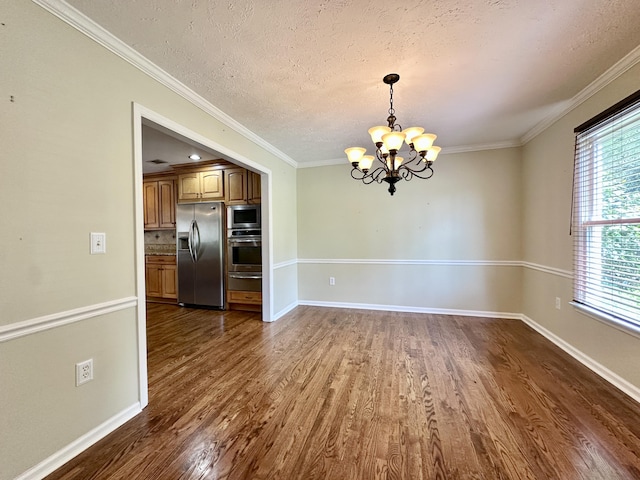 3129 Goolsby Rd, Blythe, GA 30805 - unfurnished room featuring a chandelier, dark wood-style floors, ornamental molding, a textured ceiling, and baseboards