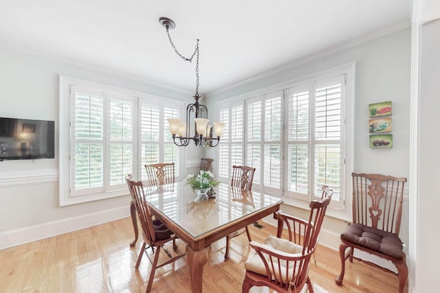 114 Altamaha Dr, North Augusta, SC 29841 - dining area with plenty of natural light, a chandelier, baseboards, wood finished floors, and crown molding