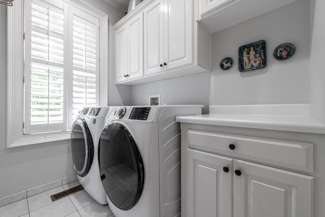114 Altamaha Dr, North Augusta, SC 29841 - washroom featuring cabinet space, washing machine and dryer, and light tile patterned floors