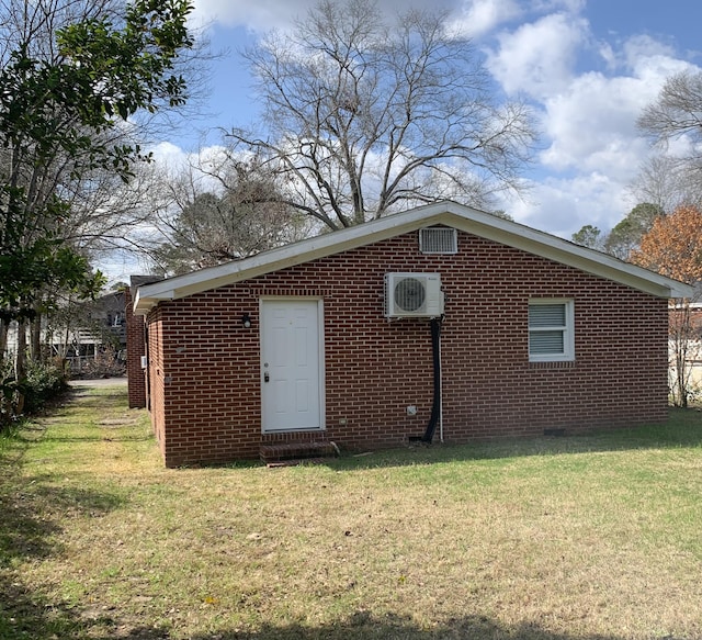 view of outbuilding featuring a lawn