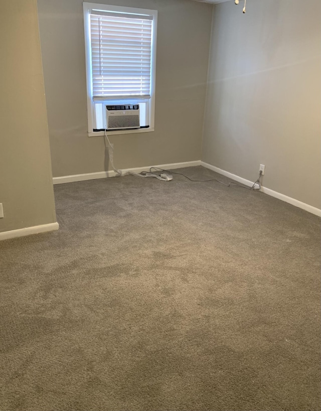 carpeted spare room featuring cooling unit