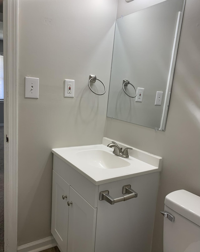 bathroom with vanity and toilet