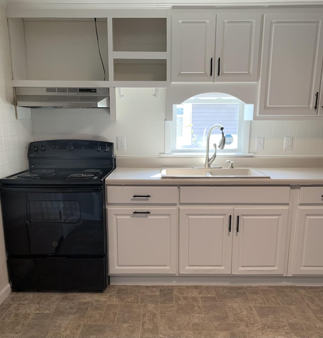 kitchen with white cabinets, sink, and electric range