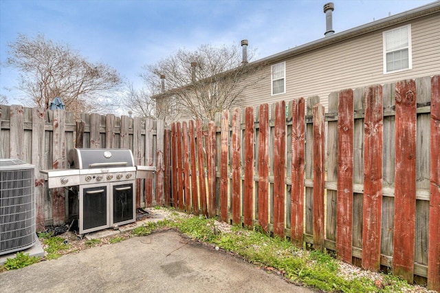 view of patio featuring central AC unit and grilling area