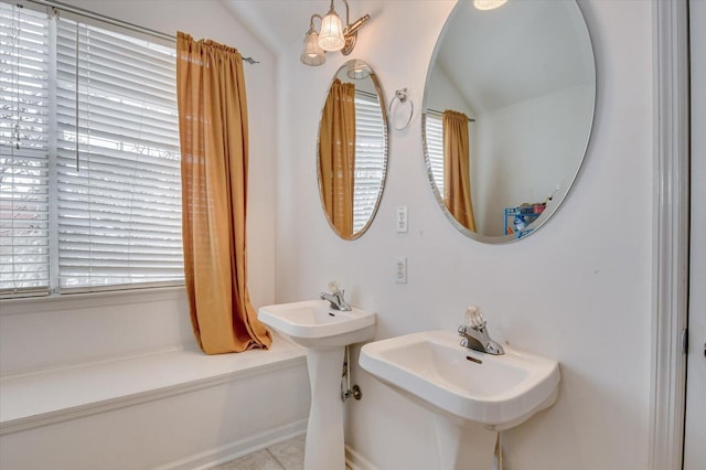 bathroom with dual sinks