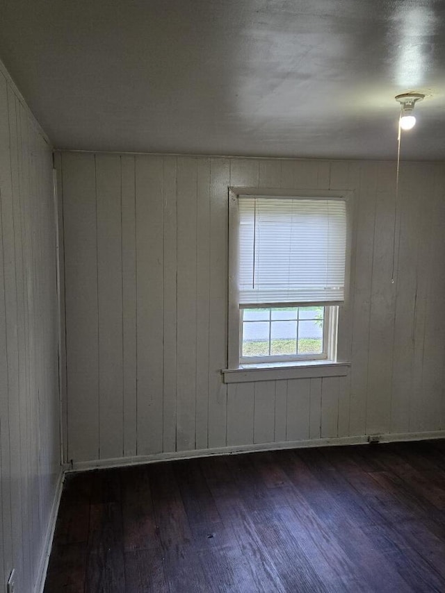 213 Whitehead St, Thomson, GA 30824 - unfurnished room featuring dark wood-style flooring and wooden walls
