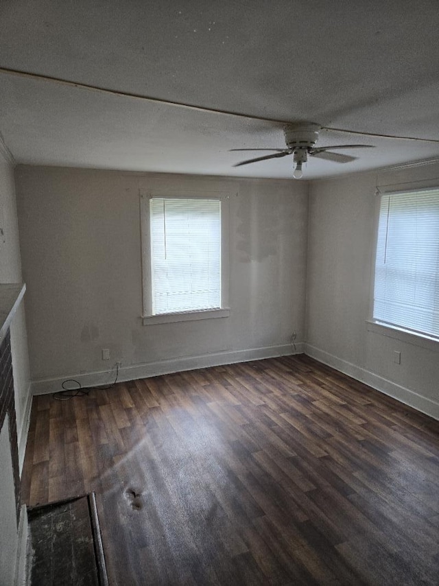 213 Whitehead St, Thomson, GA 30824 - unfurnished room featuring healthy amount of natural light, wood finished floors, a ceiling fan, baseboards, and a textured ceiling
