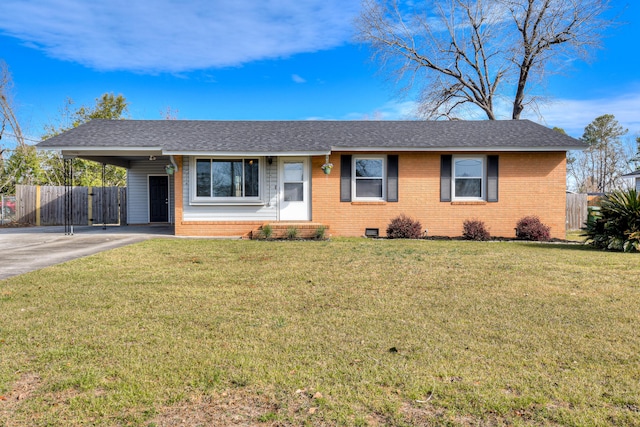 ranch-style house featuring a front yard, fence, a carport, and brick siding