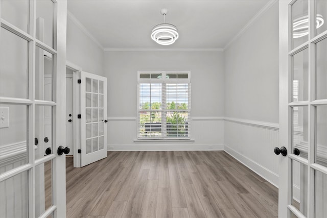751 Bancroft Dr, Grovetown, GA 30813 - empty room featuring french doors, light wood-type flooring, ornamental molding, and a wainscoted wall
