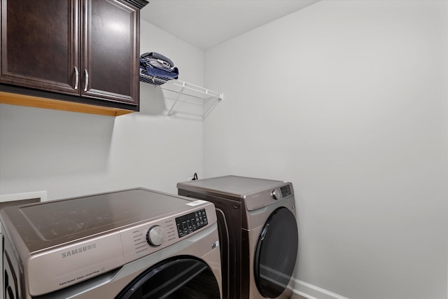 751 Bancroft Dr, Grovetown, GA 30813 - laundry area featuring cabinet space and separate washer and dryer