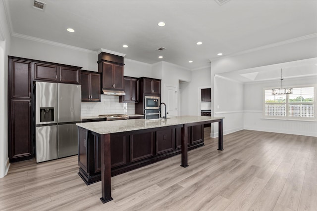 751 Bancroft Dr, Grovetown, GA 30813 - kitchen featuring stainless steel appliances, a chandelier, a large island with sink, decorative backsplash, and light wood-style floors