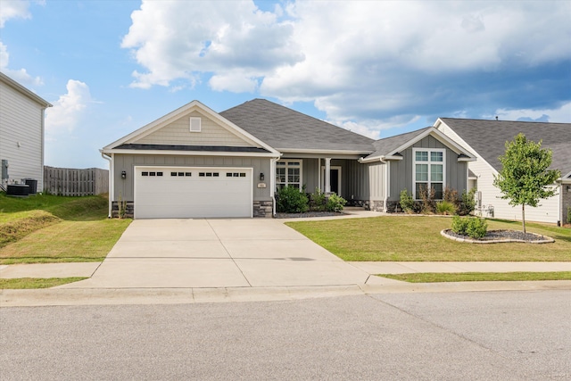 751 Bancroft Dr, Grovetown, GA 30813 - craftsman-style house featuring board and batten siding, an attached garage, driveway, and a shingled roof