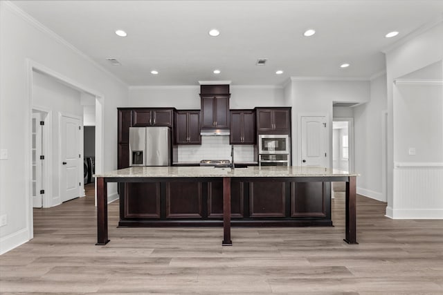 751 Bancroft Dr, Grovetown, GA 30813 - kitchen featuring a large island with sink, stainless steel appliances, a breakfast bar, dark brown cabinetry, and recessed lighting