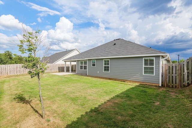 751 Bancroft Dr, Grovetown, GA 30813 - back of property featuring a shingled roof, a patio area, and a fenced backyard