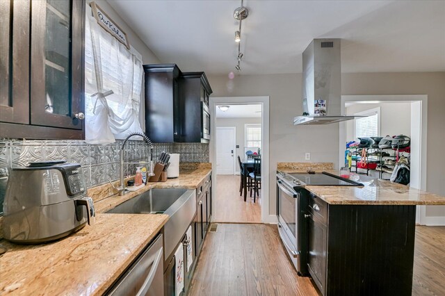 501 Beaufort Dr, Augusta, GA 30904 - kitchen with stainless steel appliances, island range hood, tasteful backsplash, and light wood-style flooring