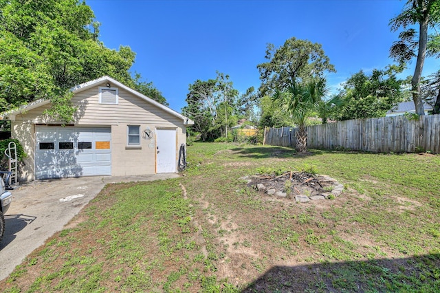 501 Beaufort Dr, Augusta, GA 30904 - view of yard featuring a detached garage, concrete driveway, and an outbuilding